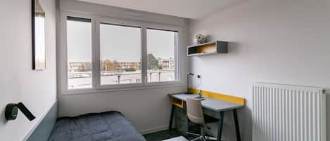 Estudi bàsic, 1 llit individual | 1 dormitori, cortines opaques i habitacions insonoritzades