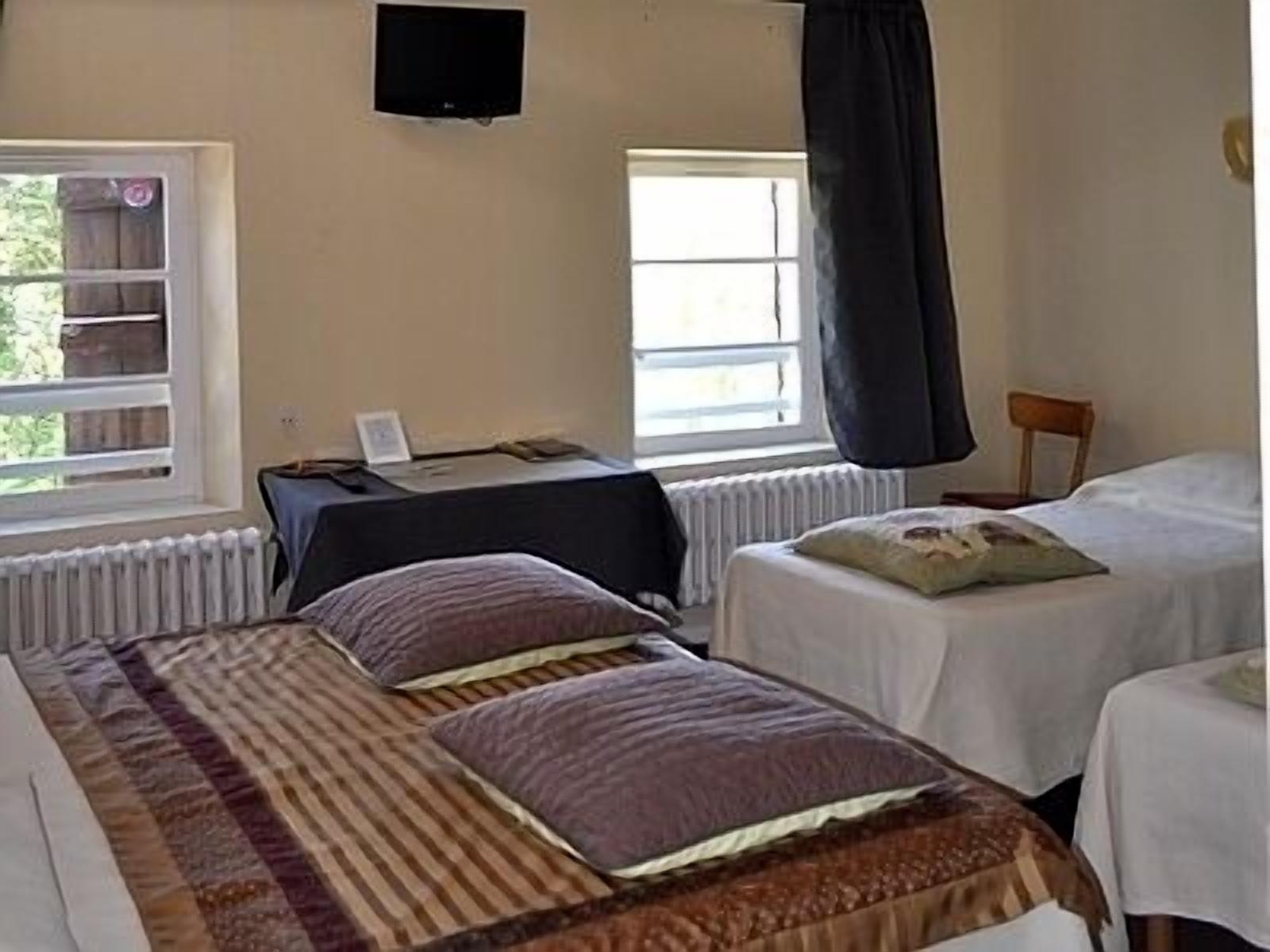 family room | premium bedding, desk, blackout curtains, iron/ironing board