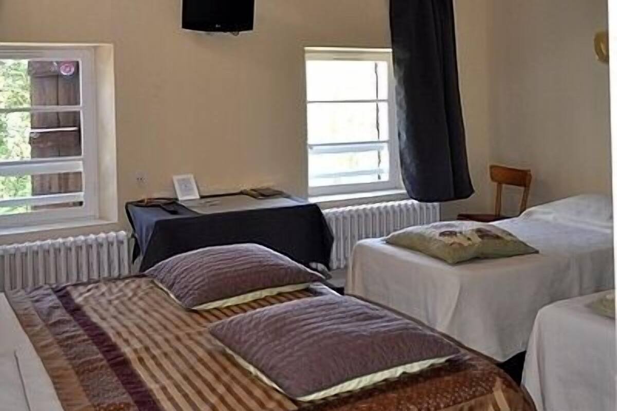 family room | premium bedding, desk, blackout curtains, iron/ironing board