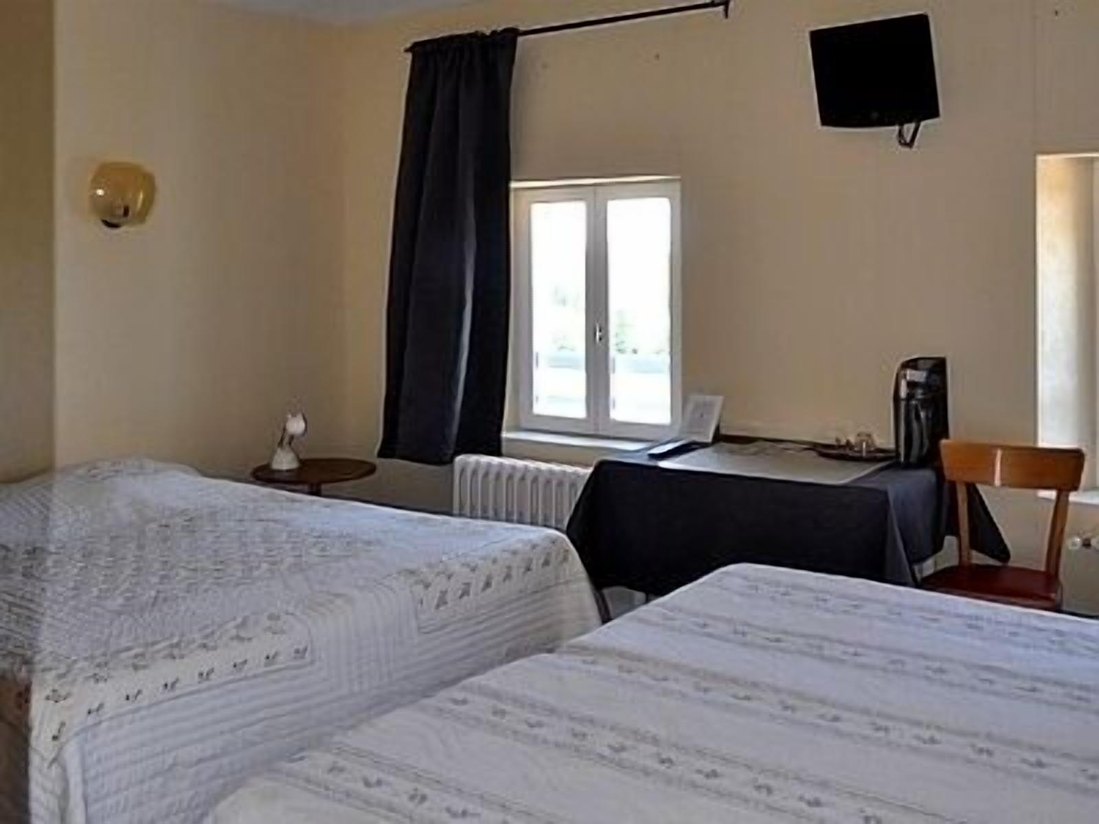 family room | premium bedding, desk, blackout curtains, iron/ironing board