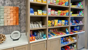 A well-organized pantry stocked with various food items and household goods.