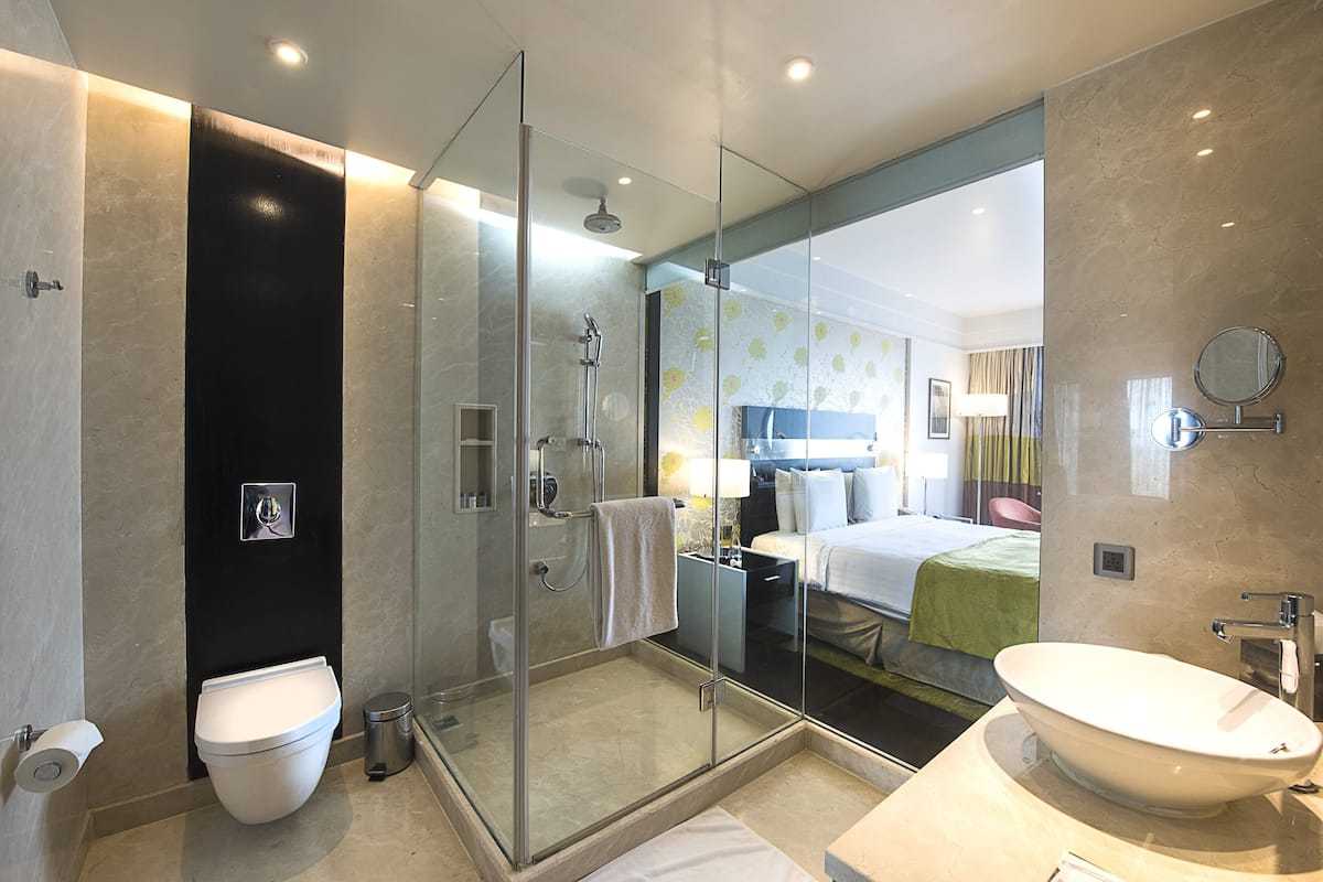 separate bathtub and shower, deep-soaking bathtub, rainfall showerhead