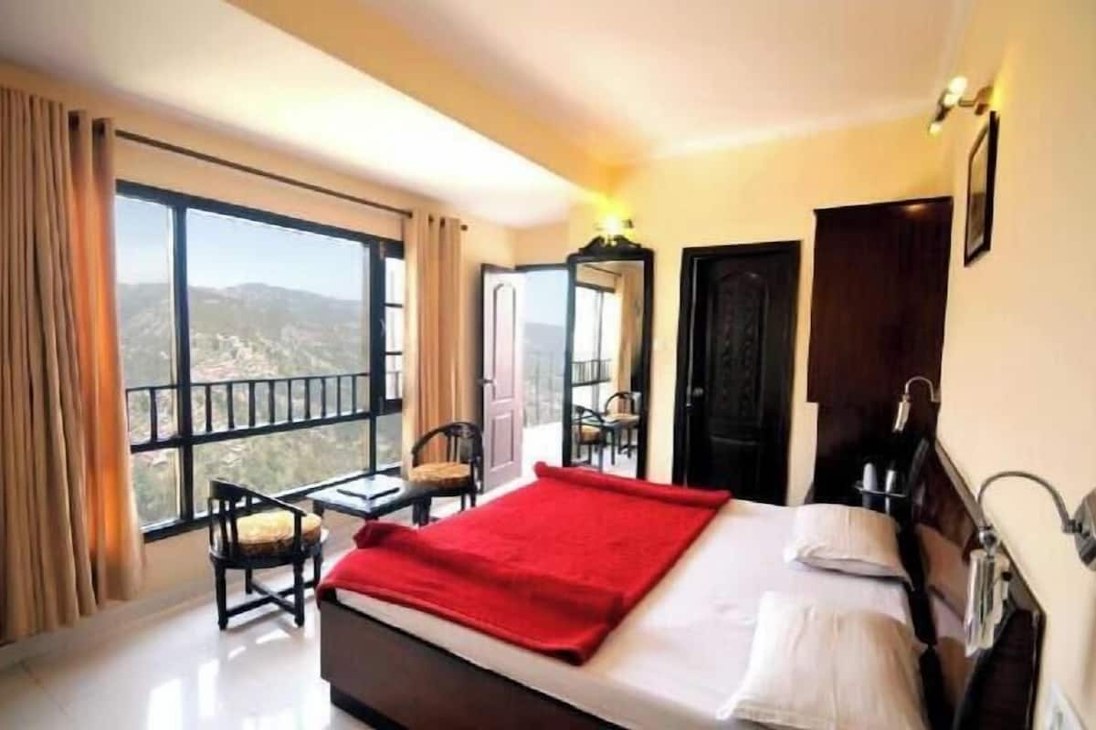 Premium bedding, desk, laptop workspace, blackout curtains