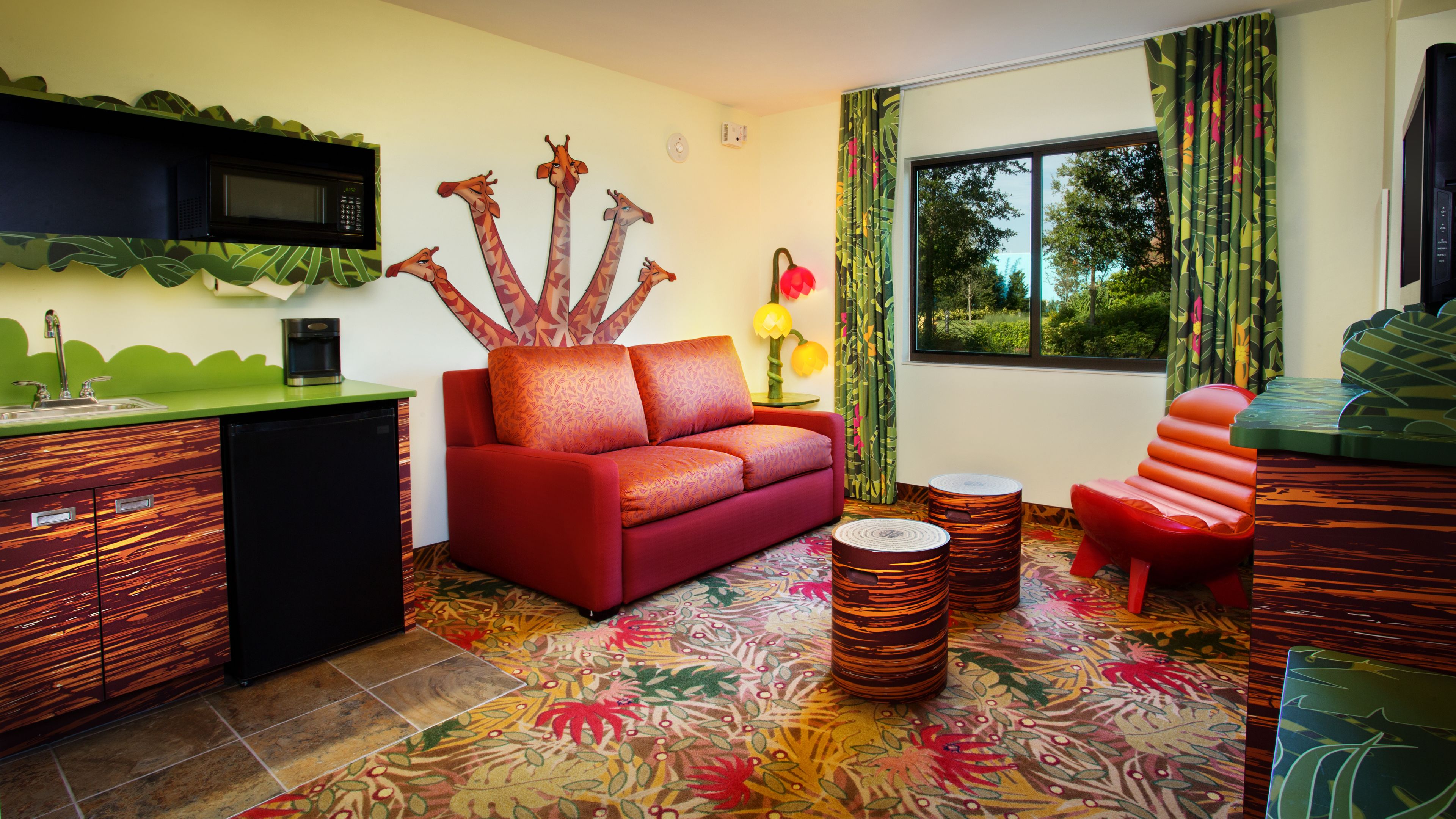 family suite (lion king) | living area | flat-screen tv