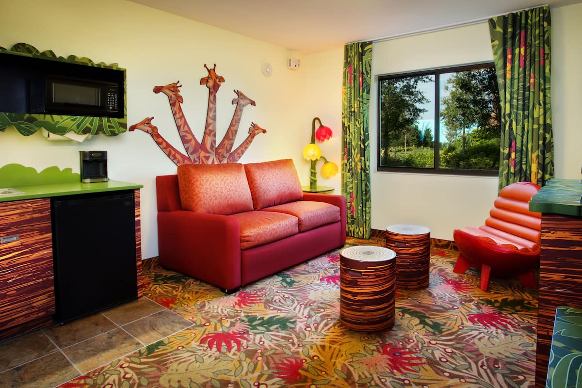 family suite (lion king) | living area | flat-screen tv