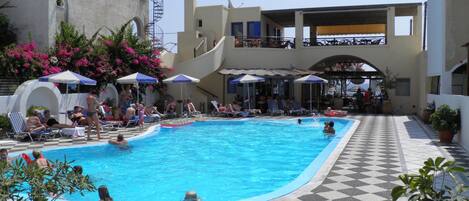 Seasonal outdoor pool, pool umbrellas, pool loungers