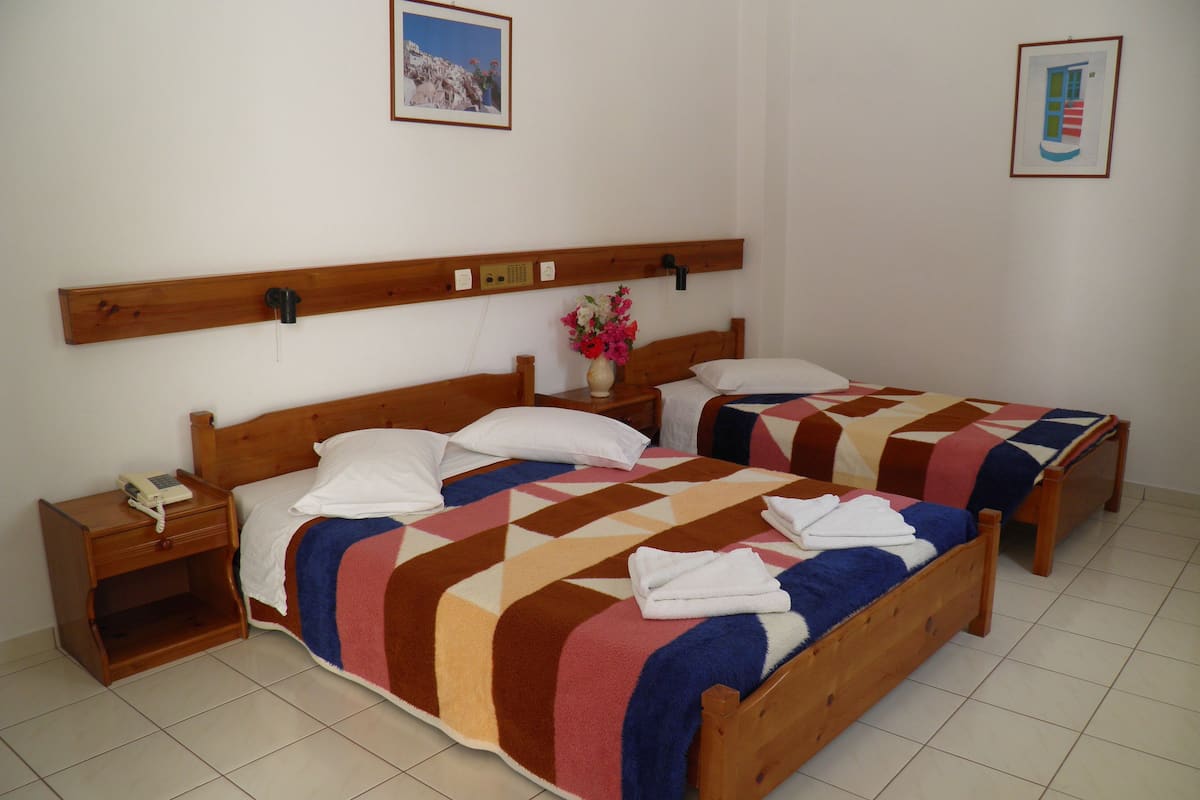 Economy Triple Room | 1 bedroom, in-room safe, iron/ironing board, free cribs/infant beds