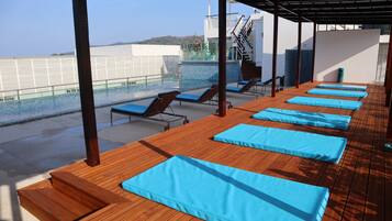 Outdoor pool, pool umbrellas, pool loungers