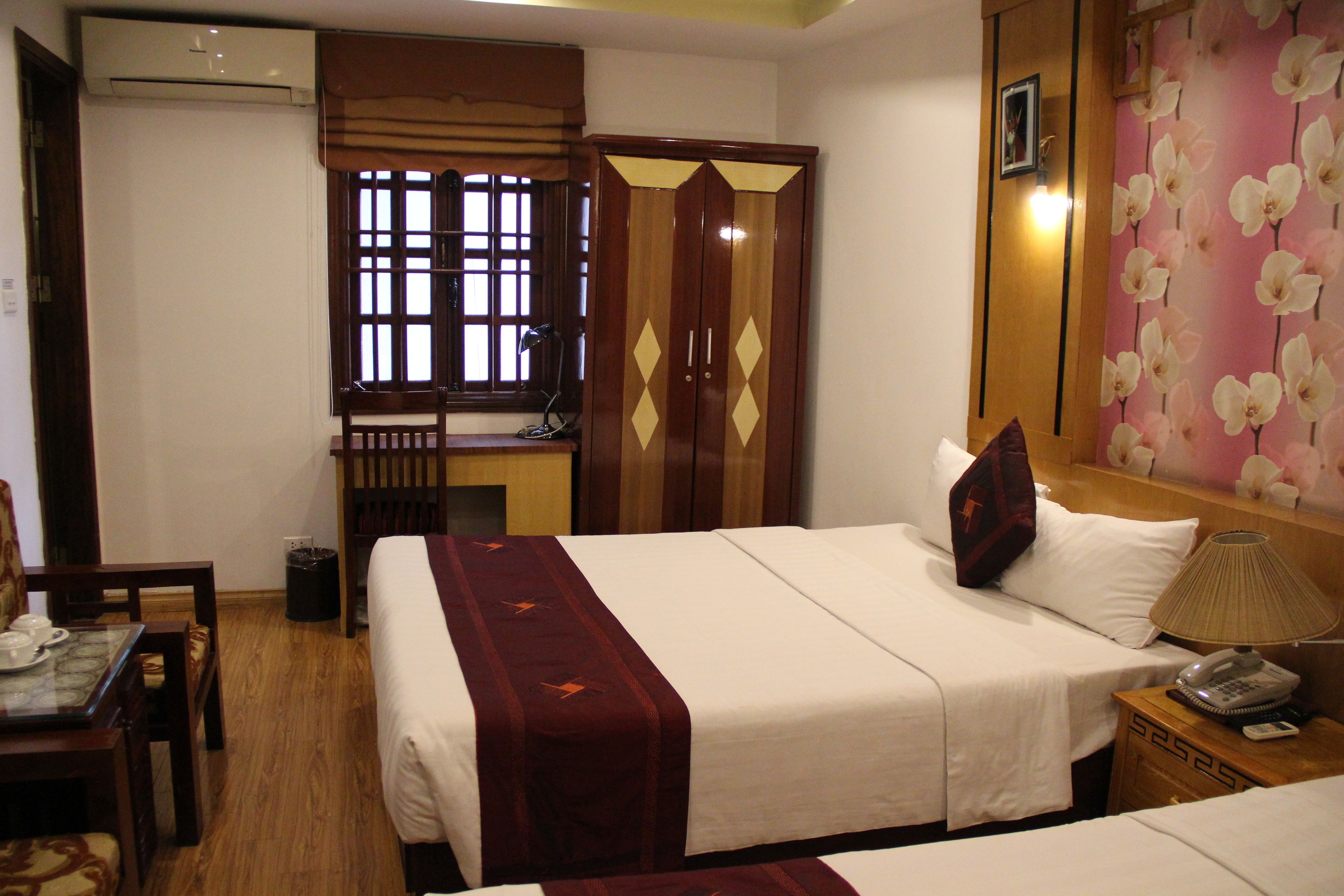 family room, 2 double beds | minibar, in-room safe, desk, iron/ironing board