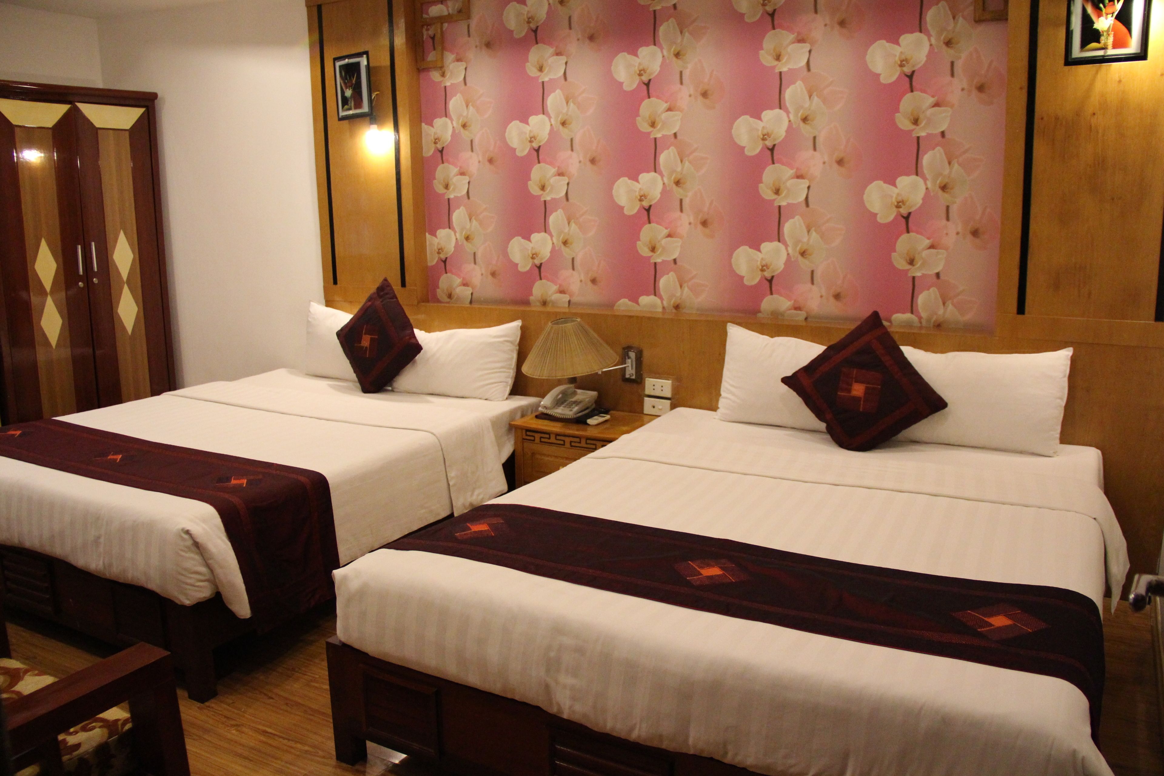 classic triple room, multiple beds, city view | minibar, in-room safe, desk, iron/ironing board