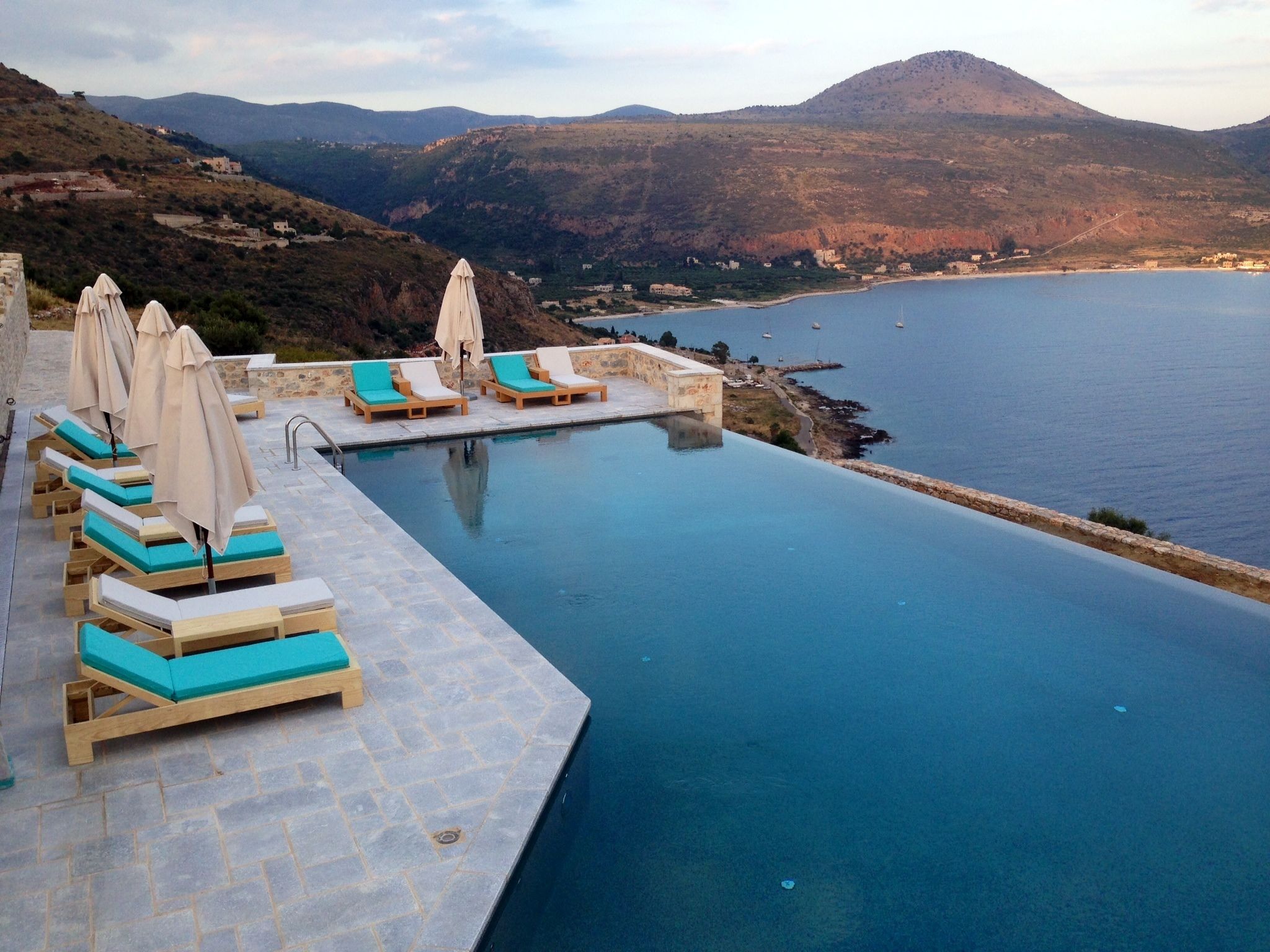 outdoor pool, open 10:00 am to 8:00 pm, pool umbrellas, pool loungers