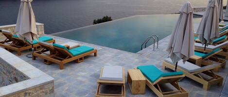 Outdoor pool, open 10:00 AM to 8:00 PM, pool umbrellas, sun loungers