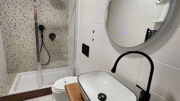 Shower, free toiletries, hair dryer, towels