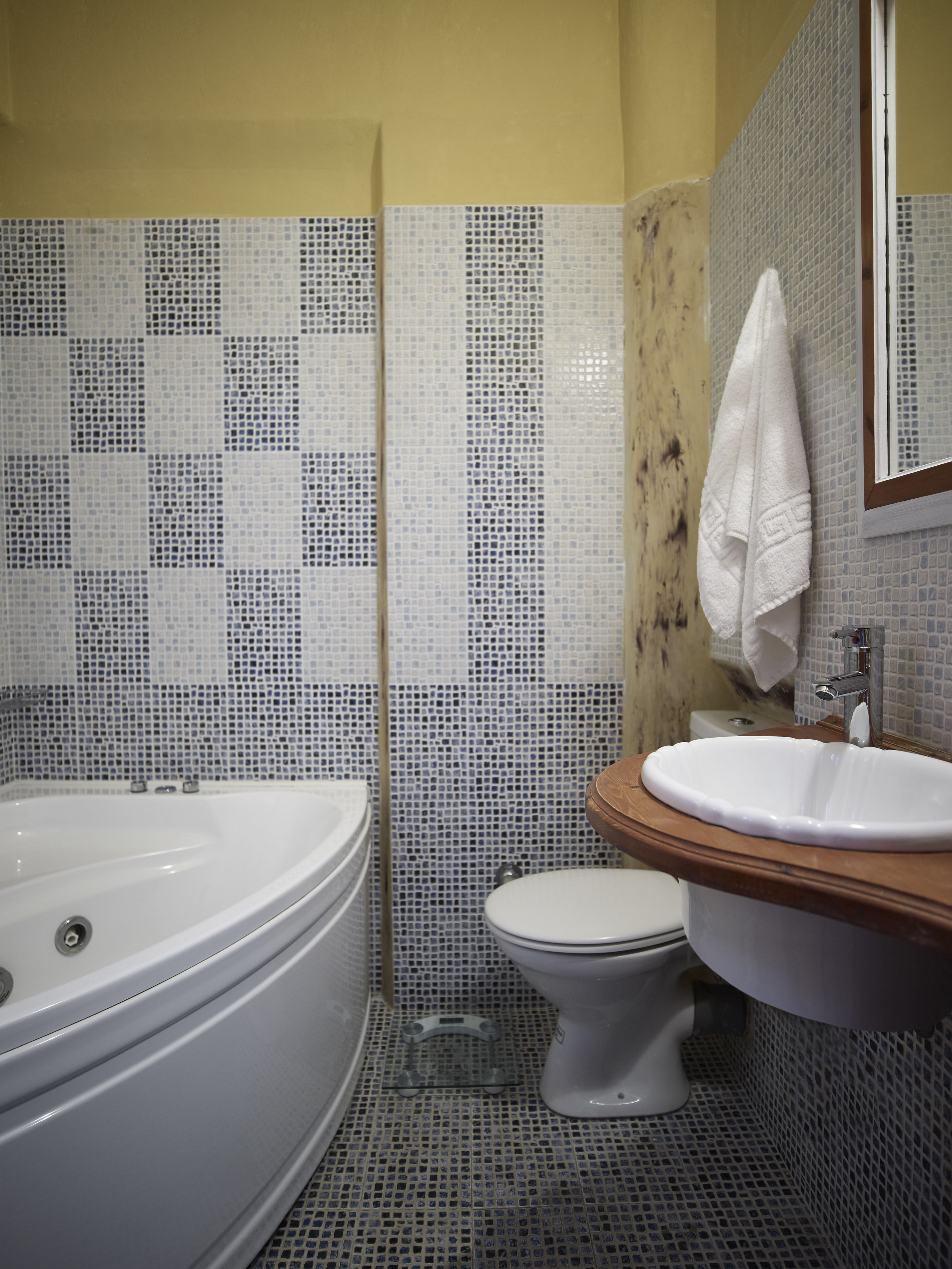 junior suite | bathroom | deep-soaking bathtub, rainfall showerhead, hair dryer, towels