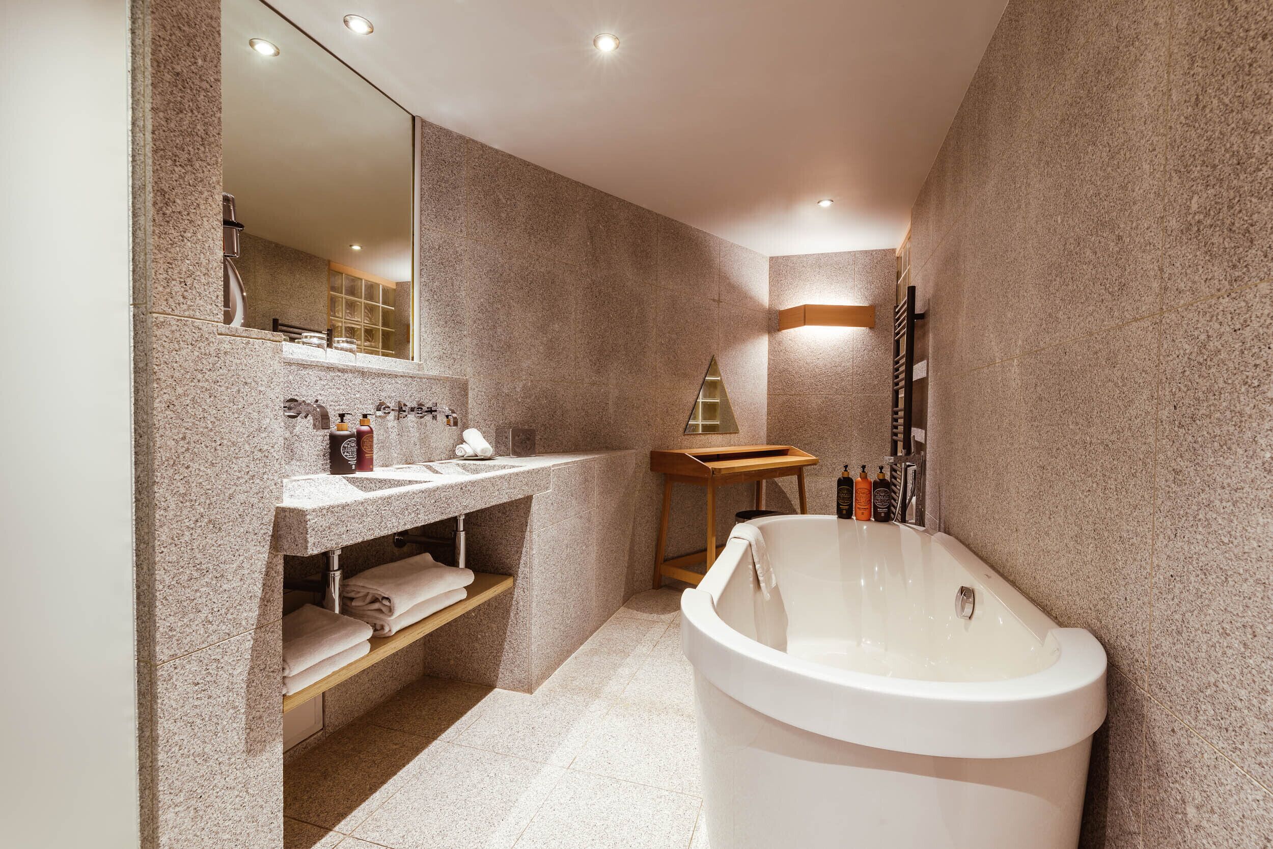 separate bathtub and shower, designer toiletries, hair dryer, bathrobes