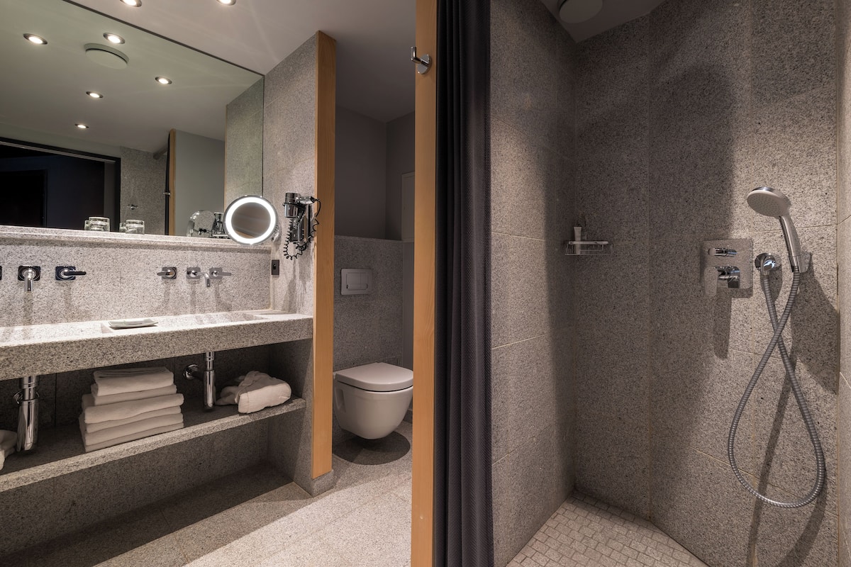 separate bathtub and shower, designer toiletries, hair dryer, bathrobes