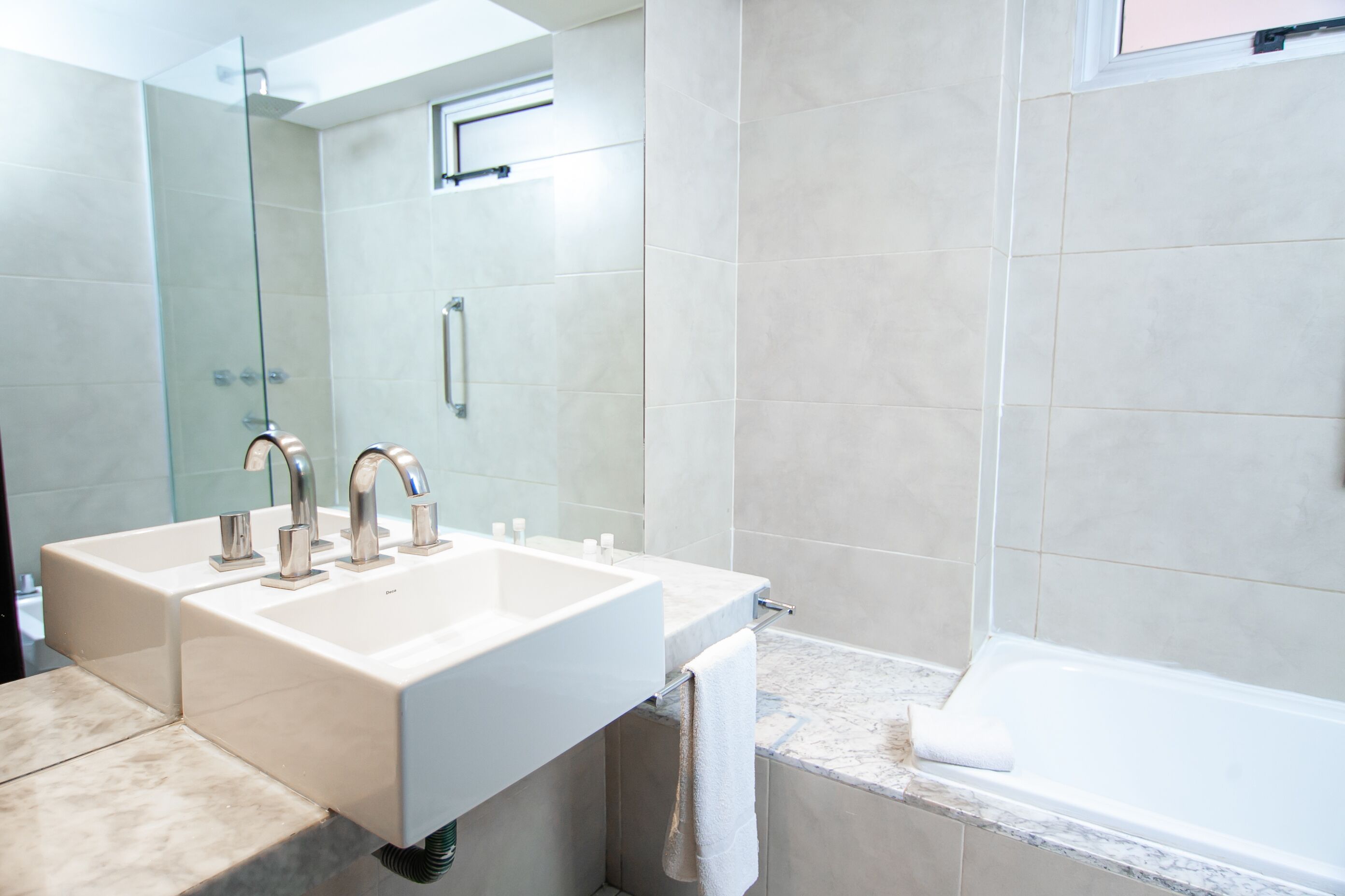 executive suite | bathroom | bathtub, hair dryer, towels