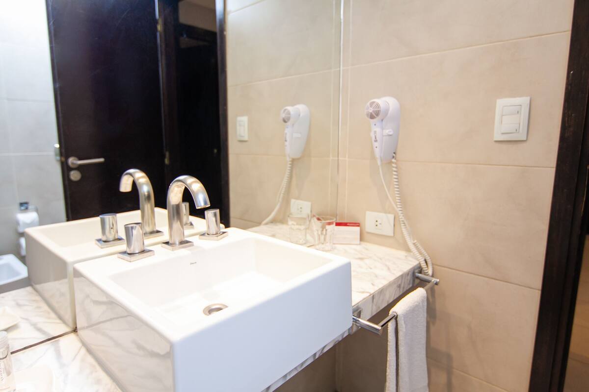 bathtub, hair dryer, towels