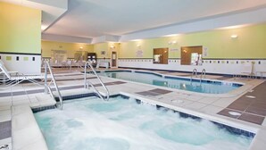 A hotel indoor pool with multiple lanes, a changing room, and a reception area. - Fairfield Inn & Suites by Marriott Kearney (Kearney)