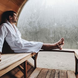 Relax in a serene space with a comfortable bench and a large window.