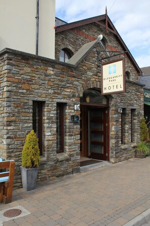 A stone building with a sign reading "Glengarriff Park Hotel." - Glengarriff Park Hotel (Glengarriff)