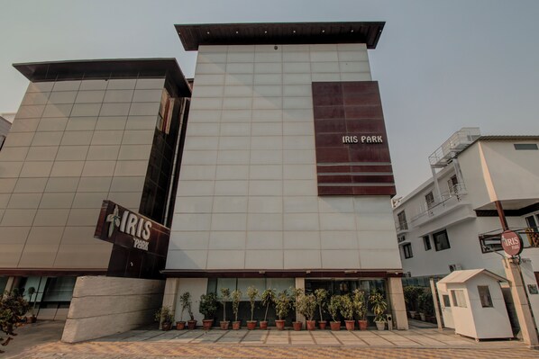 A modern building with a sign reading "IRIS PARK".