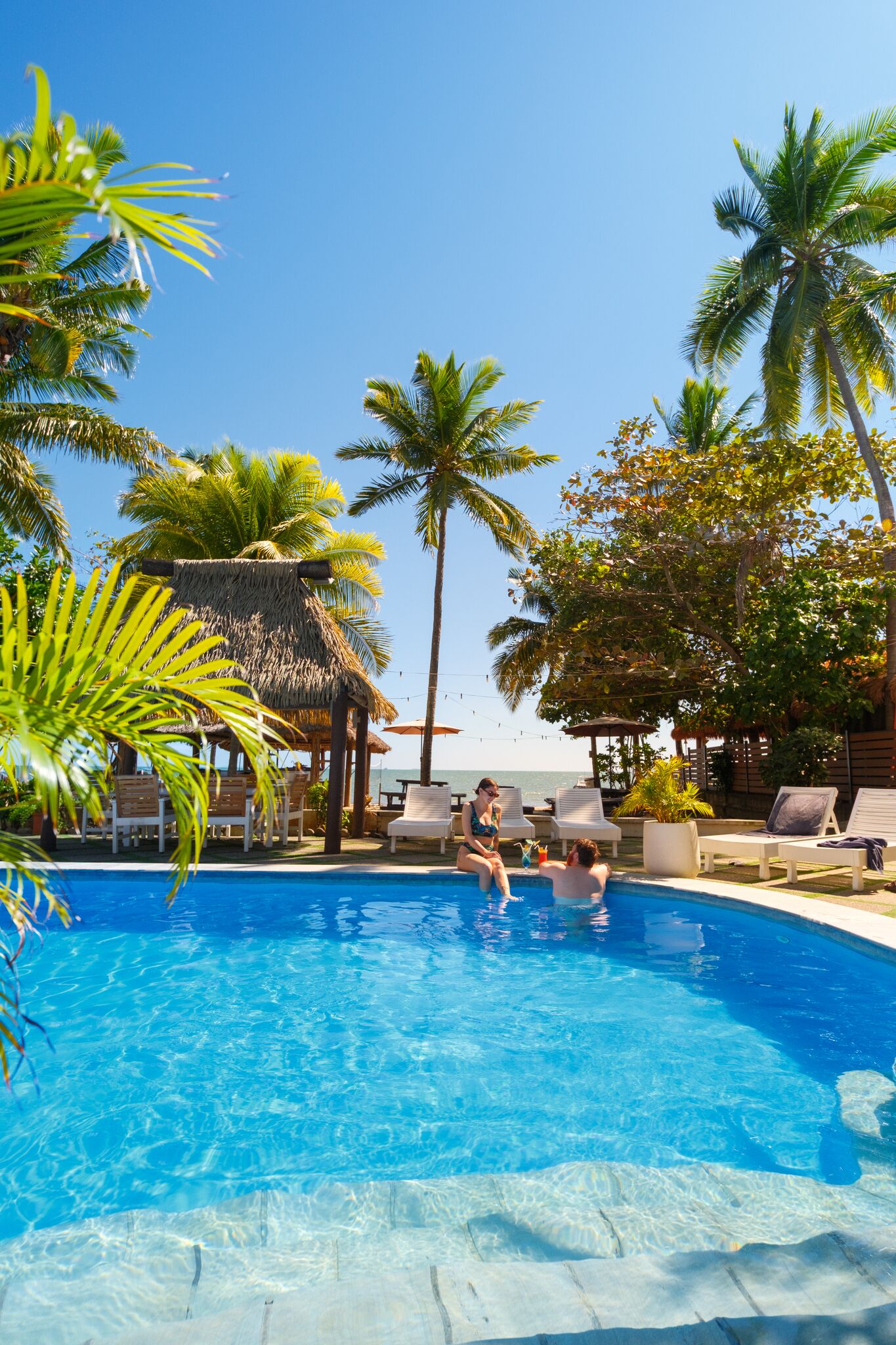 Outdoor pool, open 6:00 AM to 10:00 PM, pool umbrellas, sun loungers