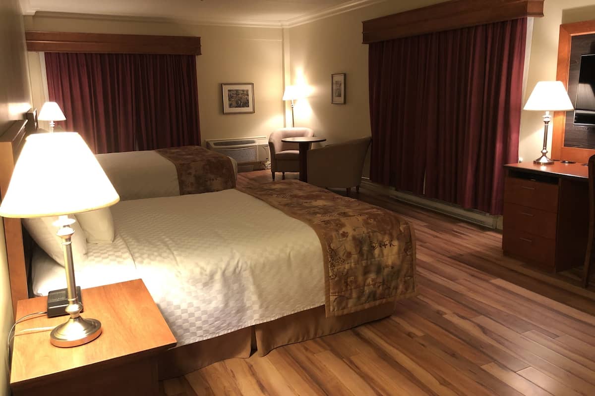 Individually decorated, desk, blackout drapes, iron/ironing board