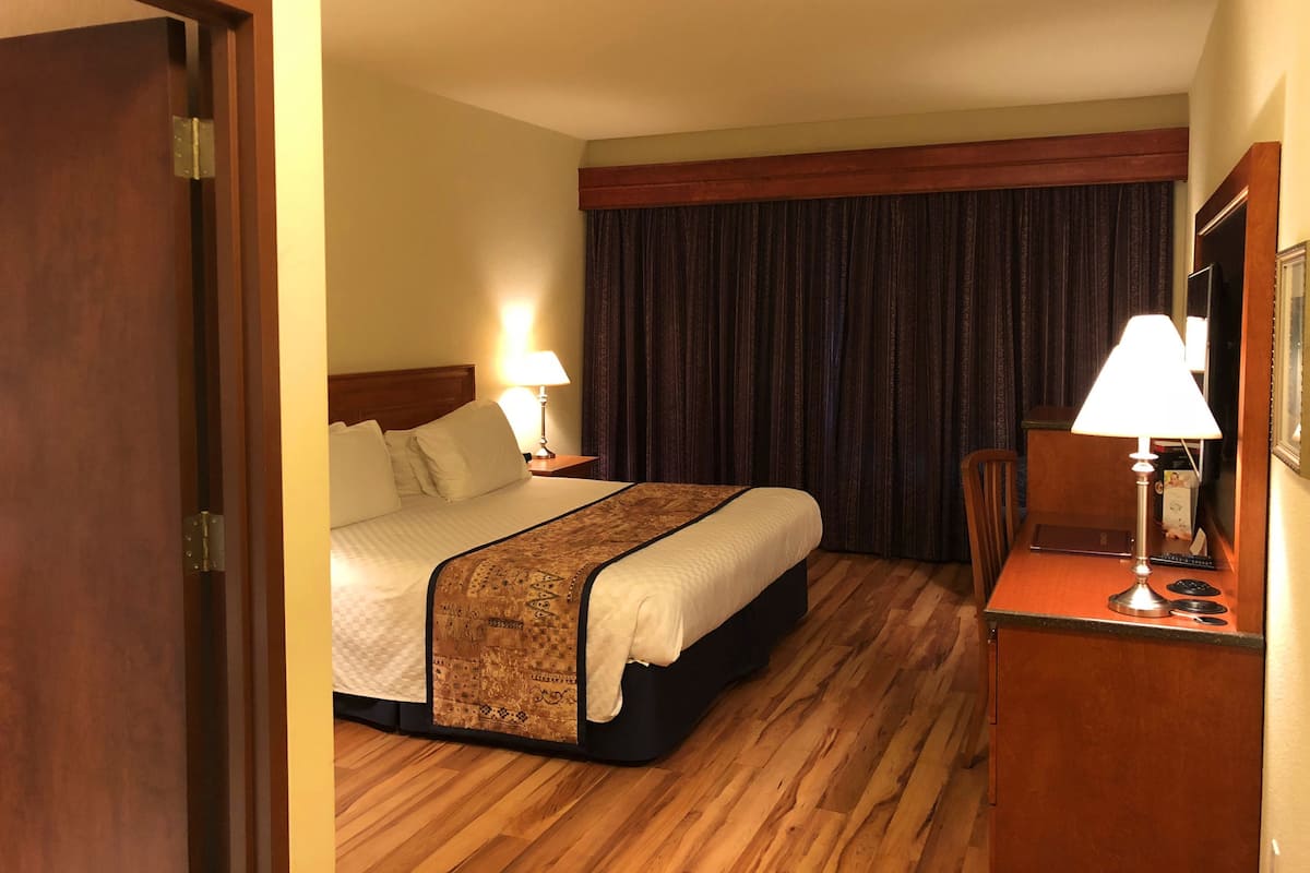 Individually decorated, desk, blackout drapes, iron/ironing board