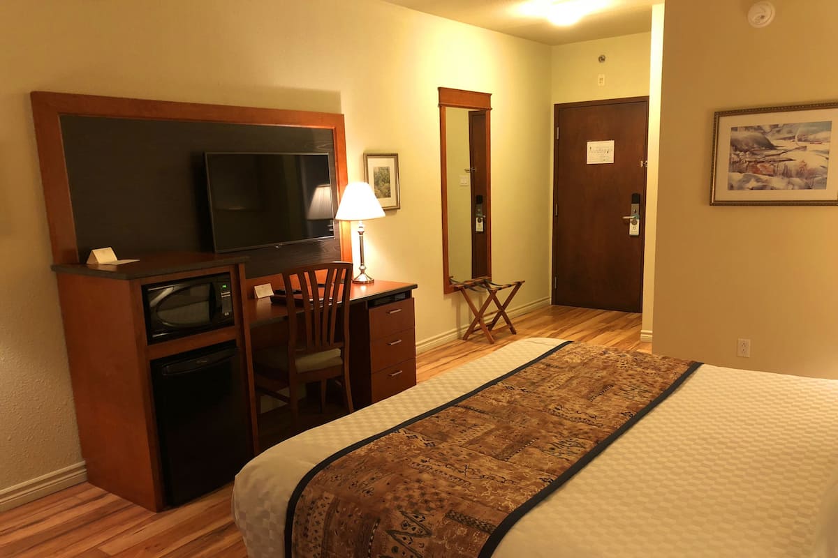 Individually decorated, desk, blackout drapes, iron/ironing board