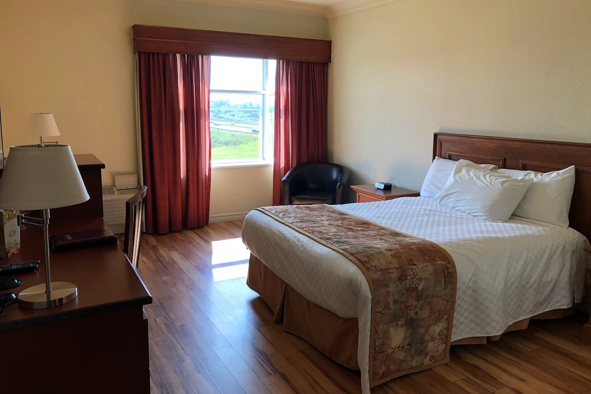 Individually decorated, desk, blackout drapes, iron/ironing board