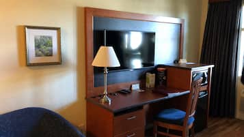 Individually decorated, desk, blackout drapes, iron/ironing board