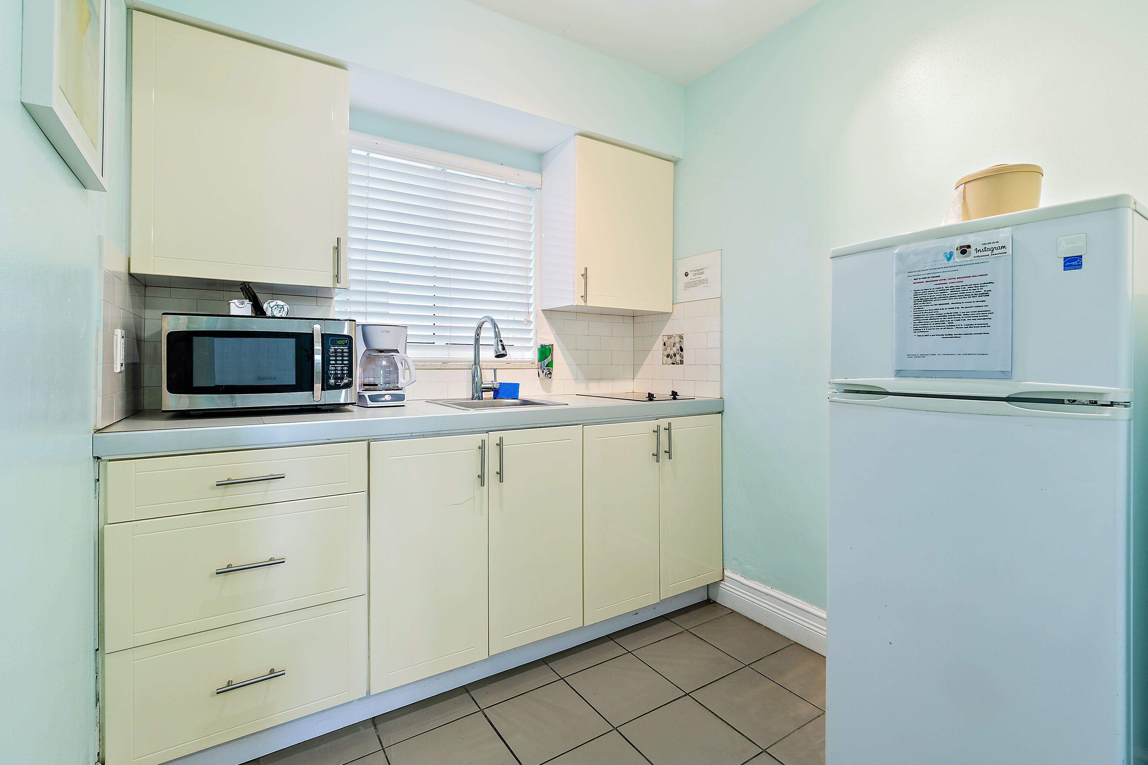 boutique studio, 1 queen bed | private kitchen | full-sized fridge, microwave