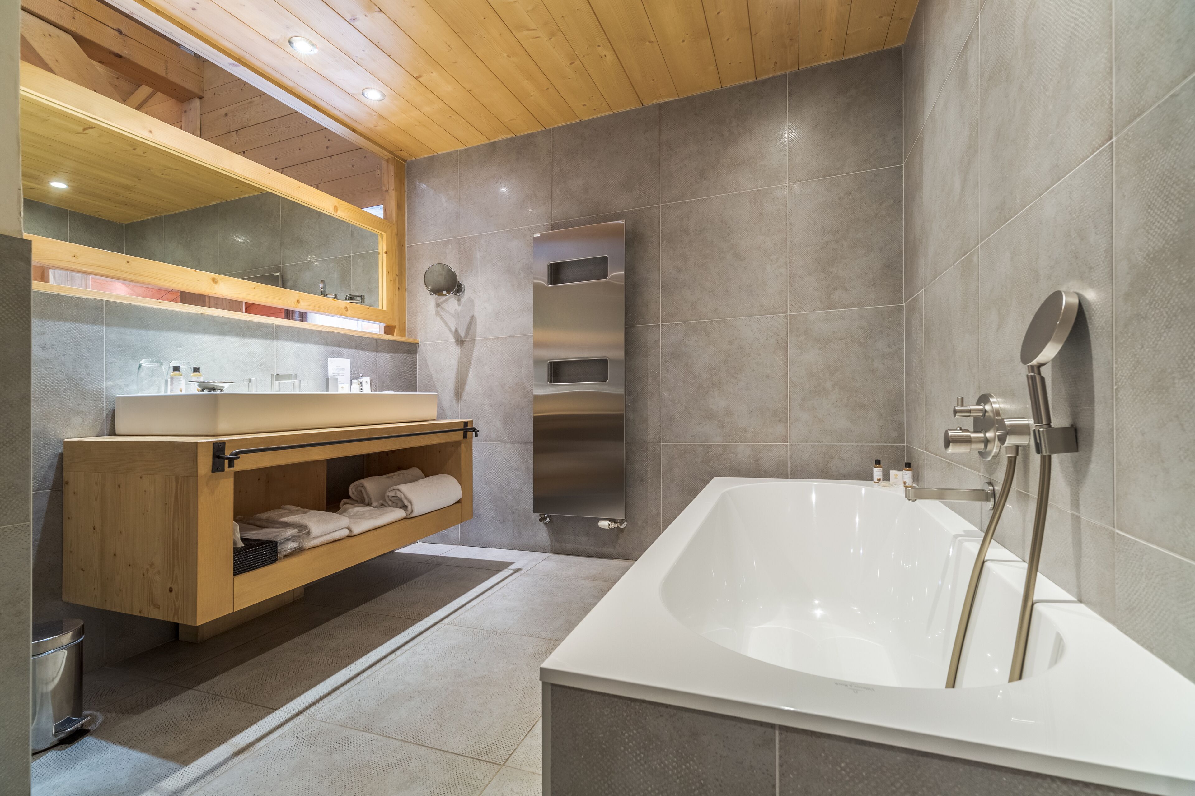 junior suite | bathroom | separate bathtub and shower, deep-soaking bathtub, rainfall showerhead