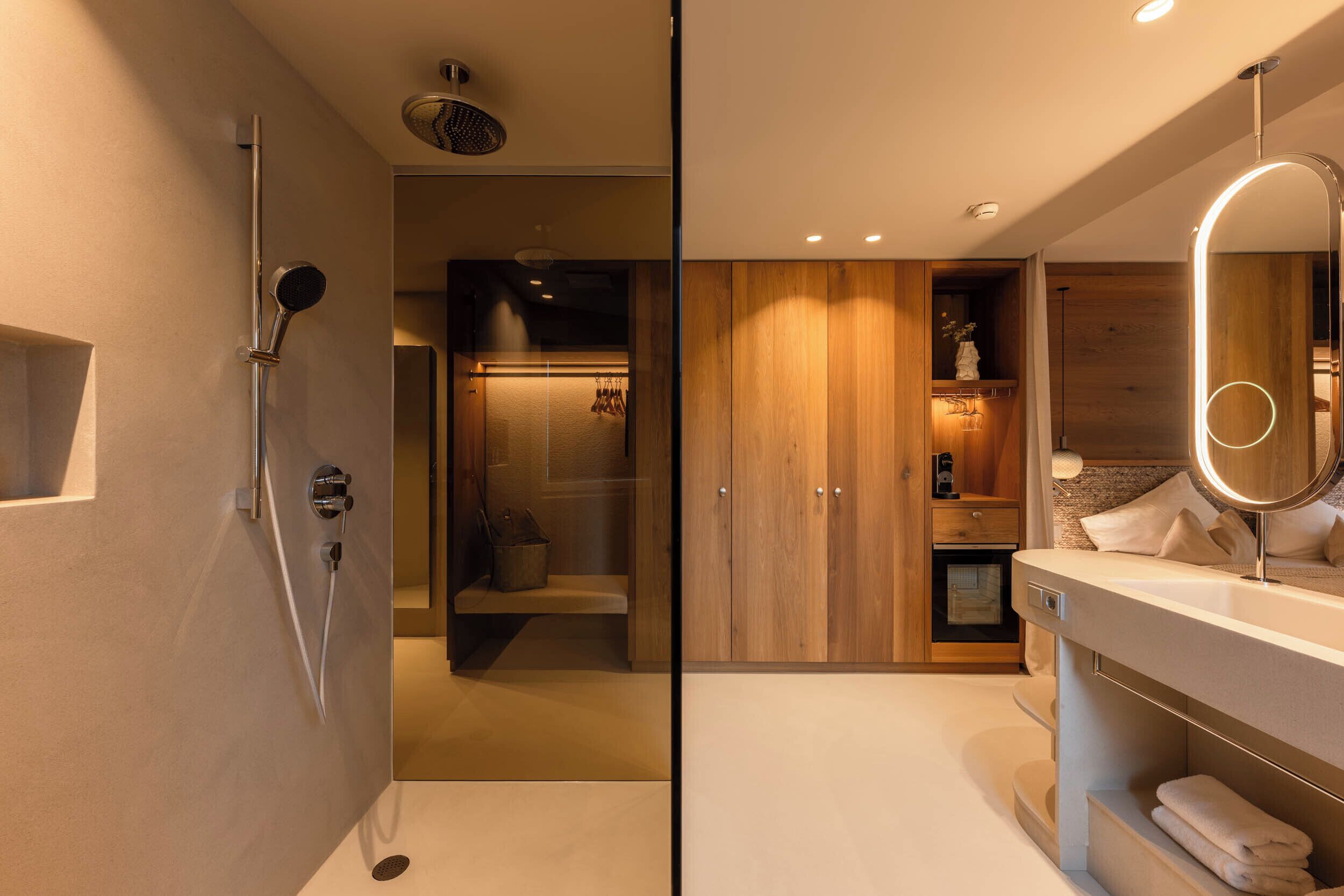 A modern bathroom with a shower, vanity, and a mirror.