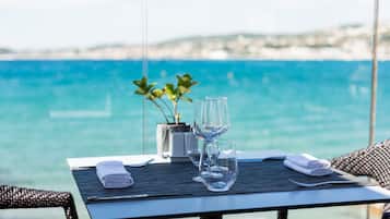 Lunch, dinner served; Mediterranean cuisine, beach views