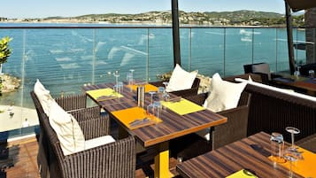 Lunch, dinner served; Mediterranean cuisine, beach views