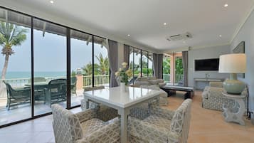 Luxury Seafront Two-Bedroom Family Suite | Living area | 32-inch LCD TV with cable channels, TV