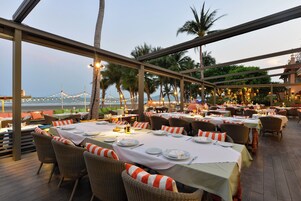 Breakfast, lunch, dinner served; international cuisine, beach views 