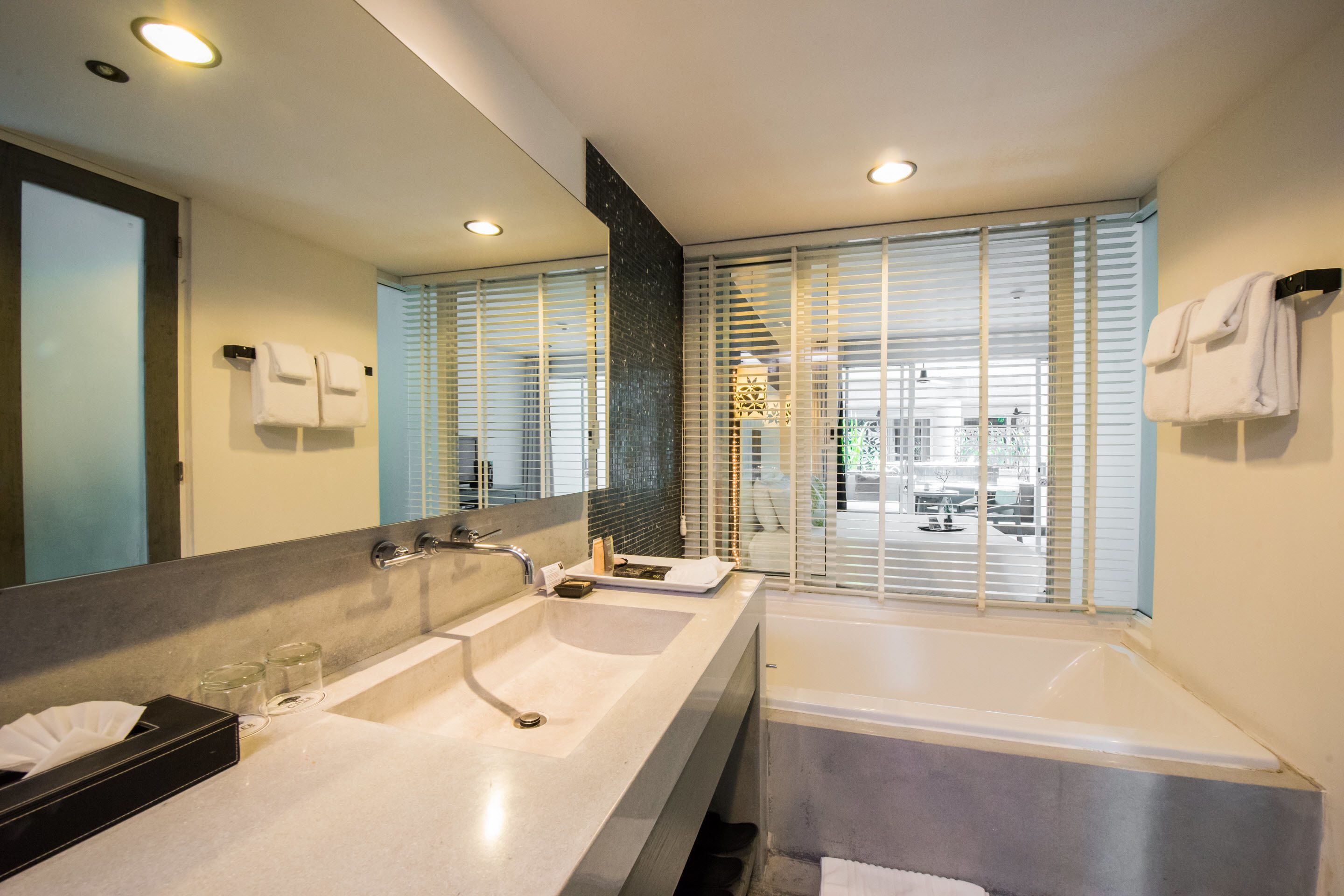 the pool paradise | bathroom | separate bathtub and shower, rainfall showerhead, free toiletries