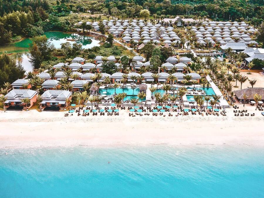On the beach, sun-loungers, beach umbrellas, beach bar