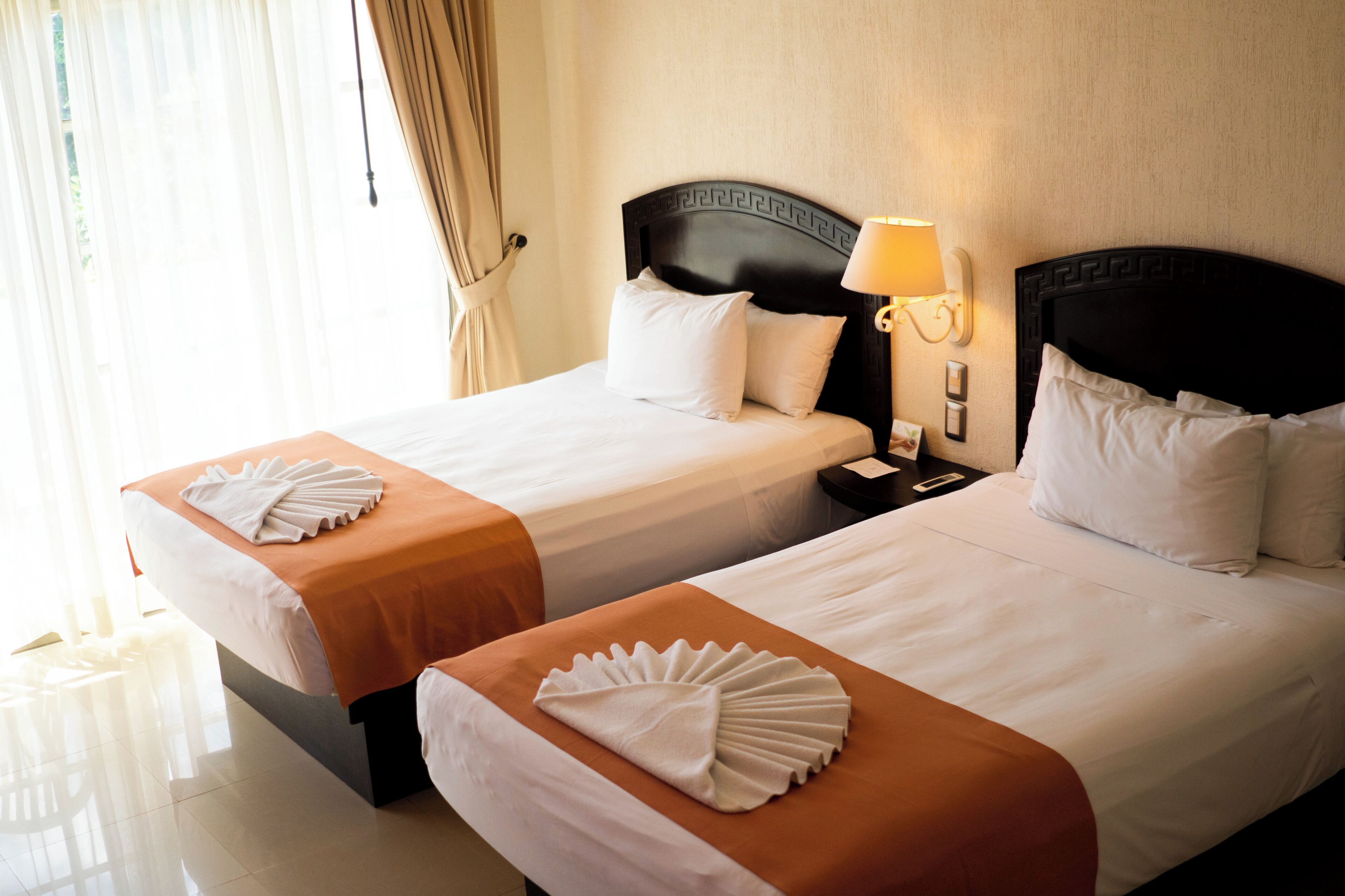standard room, 2 double beds | 1 bedroom, in-room safe, blackout curtains, iron/ironing board