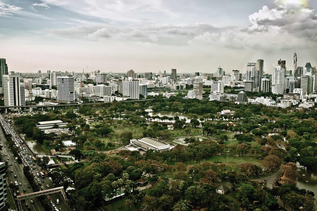 A cityscape with dense urban buildings, a river, and green spaces.
