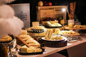 A cheese and fruit display with various types of cheese and fruits. - SO/ Bangkok (Bangkok)