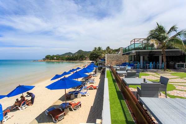Private beach, white sand, sun loungers, beach umbrellas