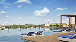 Outdoor pool, pool umbrellas, sun loungers