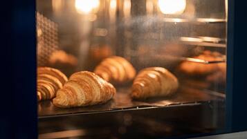A bakery display case with croissants.