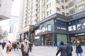 A commercial building with multiple storefronts, including a prominent LILANZ store. - Century Landscape Hotel (Xi'an)