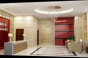 A hotel reception area with a reception desk, a chandelier, and a seating area with a sofa and armchairs. - Century Landscape Hotel (Xi'an)