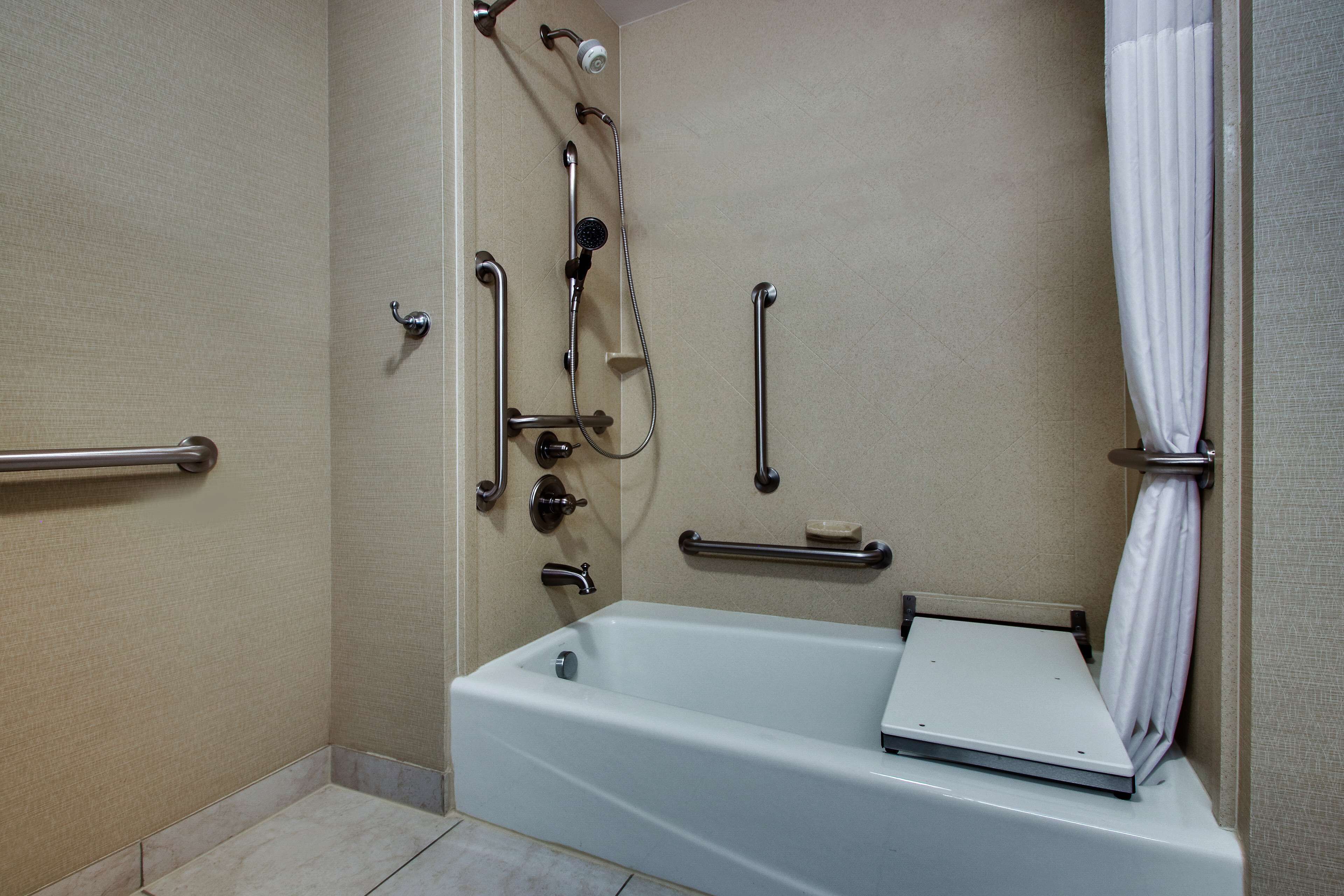bathtub, jetted bath, hair dryer, towels